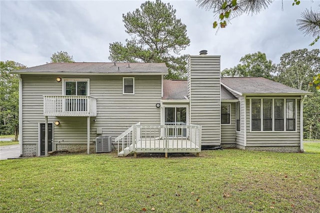 back of house with a lawn, a deck, and central AC unit