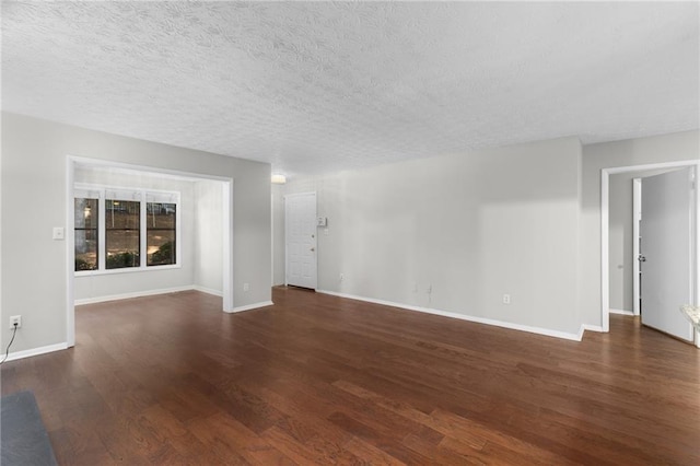 603 Summit N Dr NE Unit 603, Atlanta, GA 30324 - unfurnished living room with wood finished floors, baseboards, and a textured ceiling