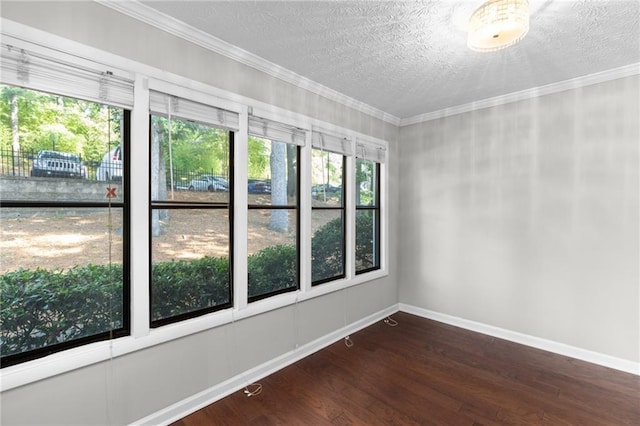603 Summit N Dr NE Unit 603, Atlanta, GA 30324 - spare room featuring healthy amount of natural light, wood finished floors, baseboards, crown molding, and a textured ceiling
