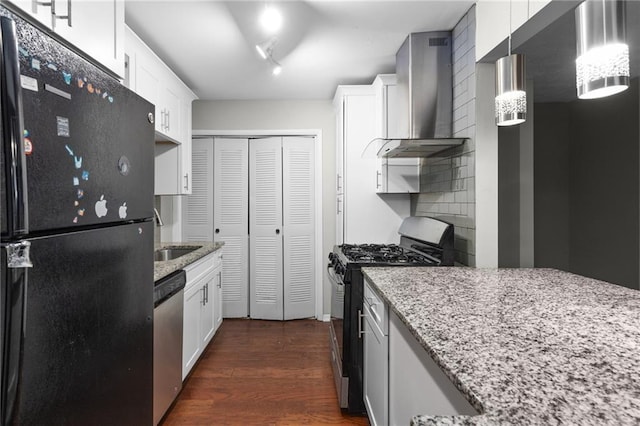 603 Summit N Dr NE Unit 603, Atlanta, GA 30324 - kitchen with stainless steel appliances, wall chimney exhaust hood, dark wood finished floors, light stone countertops, and tasteful backsplash