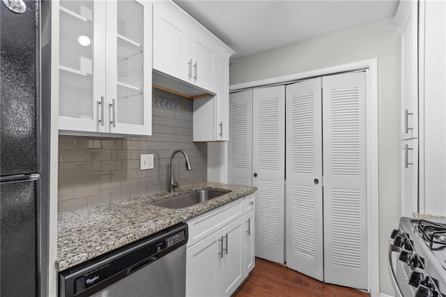 603 Summit N Dr NE Unit 603, Atlanta, GA 30324 - kitchen with appliances with stainless steel finishes, a sink, tasteful backsplash, and white cabinets