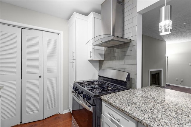 603 Summit N Dr NE Unit 603, Atlanta, GA 30324 - kitchen with stainless steel range with gas cooktop, wall chimney exhaust hood, dark wood finished floors, baseboards, and backsplash