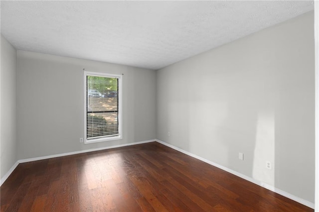 603 Summit N Dr NE Unit 603, Atlanta, GA 30324 - empty room featuring wood finished floors, baseboards, and a textured ceiling