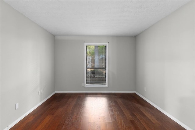 603 Summit N Dr NE Unit 603, Atlanta, GA 30324 - empty room featuring wood finished floors, baseboards, and a textured ceiling
