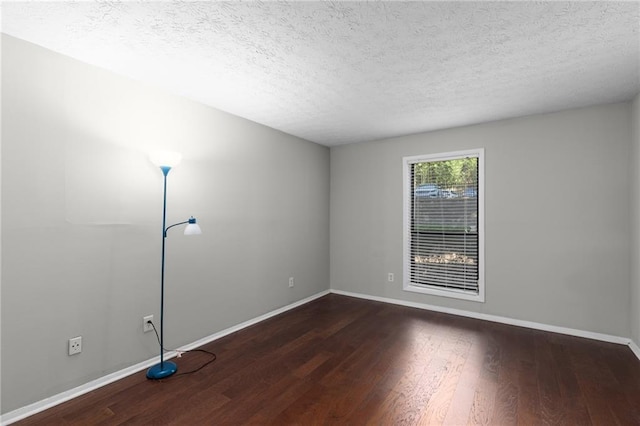 603 Summit N Dr NE Unit 603, Atlanta, GA 30324 - empty room featuring wood finished floors, a textured ceiling, and baseboards