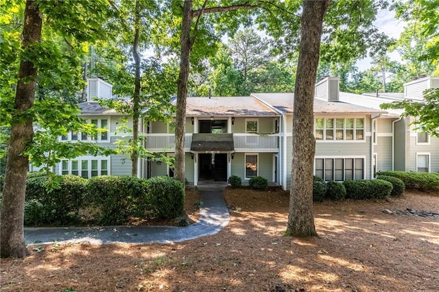 603 Summit N Dr NE Unit 603, Atlanta, GA 30324 - view of front of property featuring a chimney and a balcony