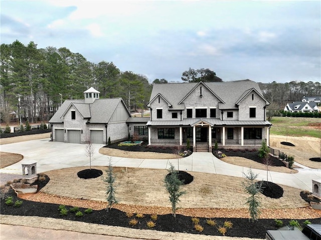 view of front of house with a porch and a garage