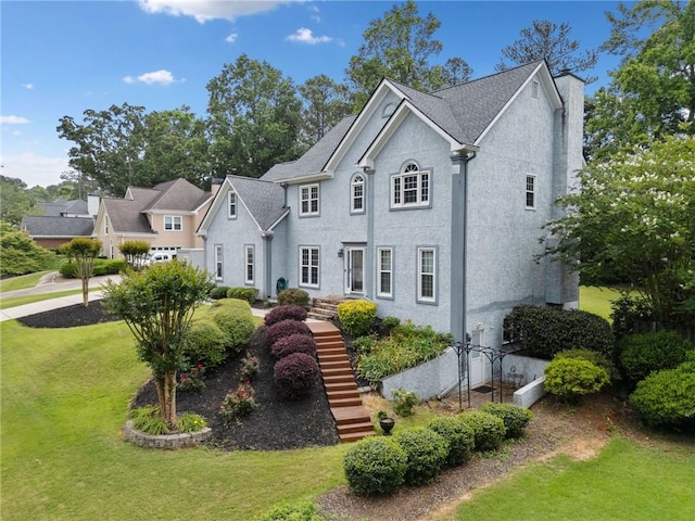 5711 Brynwood Cir NW, Acworth, GA 30101 - view of front facade with a front yard, stairs, and stucco siding
