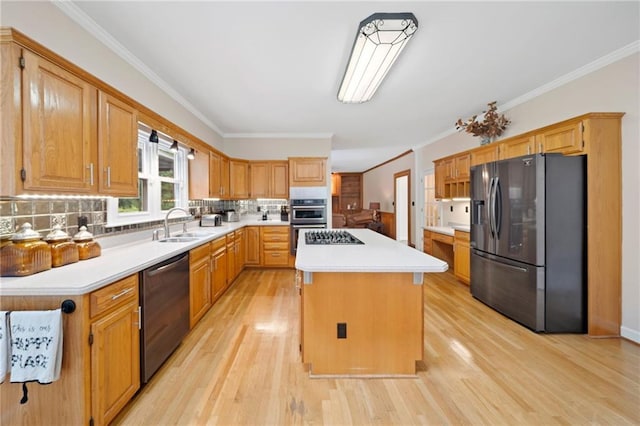 5711 Brynwood Cir NW, Acworth, GA 30101 - kitchen featuring stainless steel appliances, a kitchen island, light wood finished floors, light countertops, and decorative backsplash