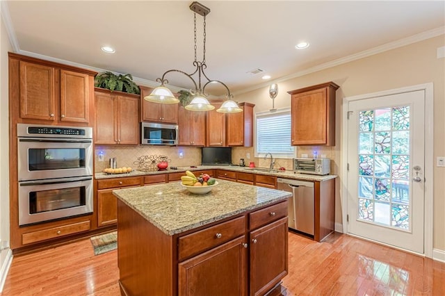 3202 Lucky Pl, Conyers, GA 30013 - kitchen featuring stainless steel appliances, brown cabinets, decorative backsplash, crown molding, and light stone countertops