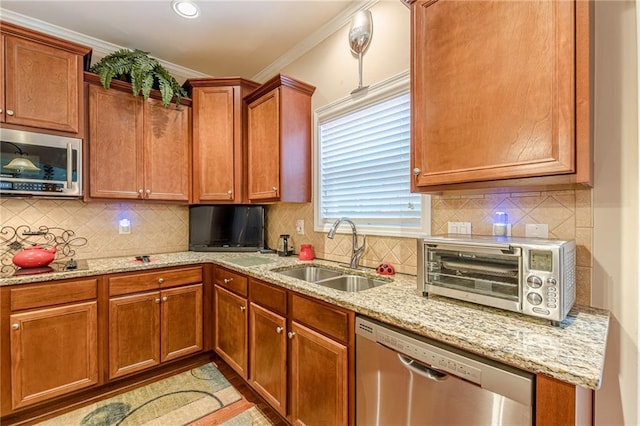 3202 Lucky Pl, Conyers, GA 30013 - kitchen featuring stainless steel appliances, light stone counters, backsplash, ornamental molding, and brown cabinetry