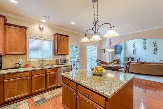 3202 Lucky Pl, Conyers, GA 30013 - kitchen with dishwasher, arched walkways, open floor plan, a center island, and crown molding