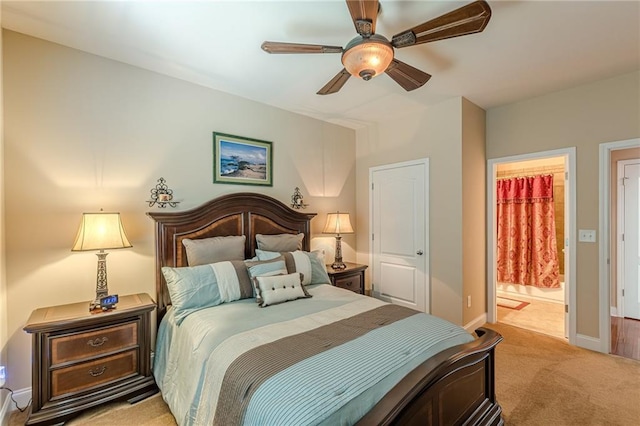 3202 Lucky Pl, Conyers, GA 30013 - bedroom with light carpet, ensuite bath, and a ceiling fan