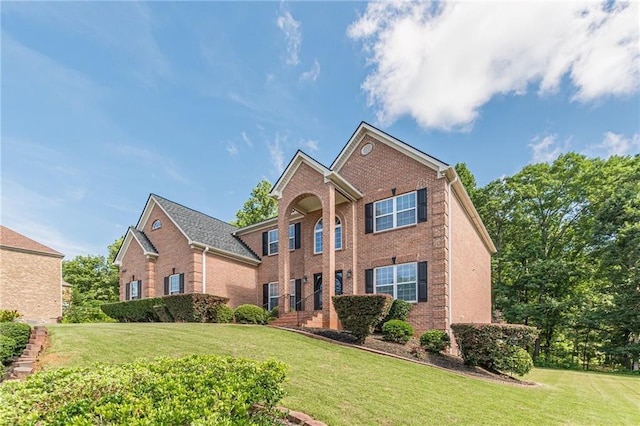 3202 Lucky Pl, Conyers, GA 30013 - traditional home with brick siding and a front lawn