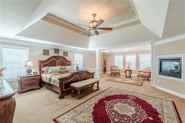 3202 Lucky Pl, Conyers, GA 30013 - bedroom with carpet, a tray ceiling, ornate columns, crown molding, and a multi sided fireplace