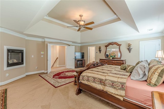 3202 Lucky Pl, Conyers, GA 30013 - bedroom with a tray ceiling, crown molding, light colored carpet, arched walkways, and ceiling fan