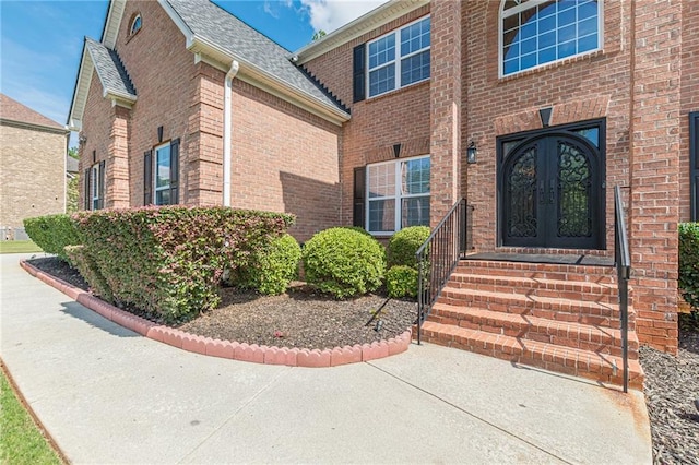 3202 Lucky Pl, Conyers, GA 30013 - entrance to property with french doors, brick siding, and roof with shingles