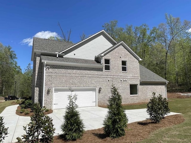 view of side of property featuring a garage