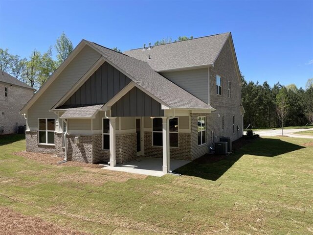 view of front of property with a garage and a front lawn