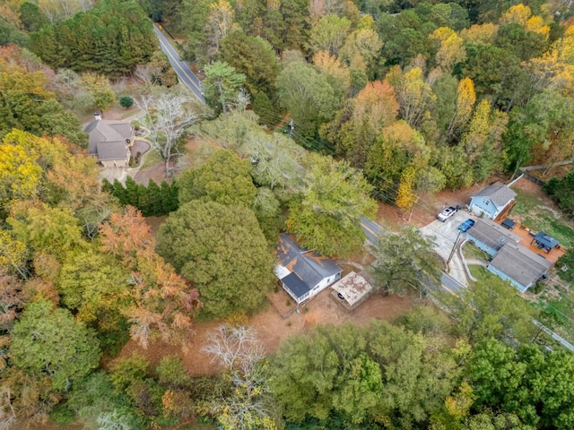 view of property location featuring a heavily wooded area