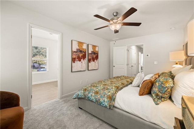 carpeted bedroom with ceiling fan