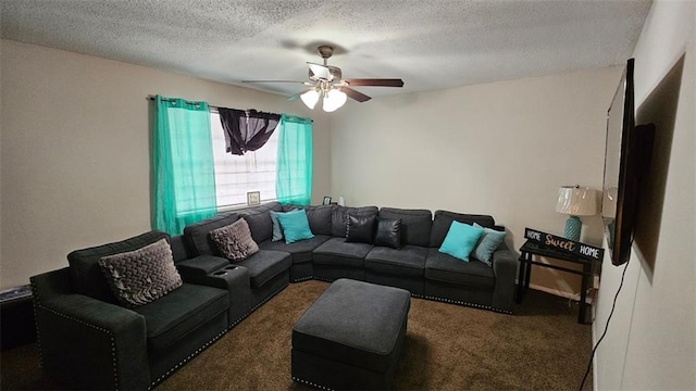 living room with ceiling fan, dark carpet, and a textured ceiling