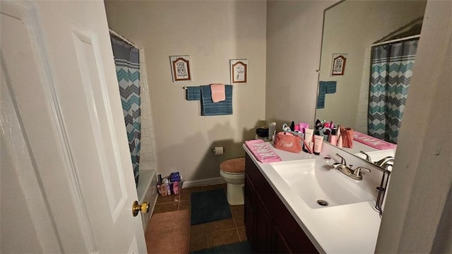 full bath with shower / tub combo, vanity, toilet, and tile patterned floors