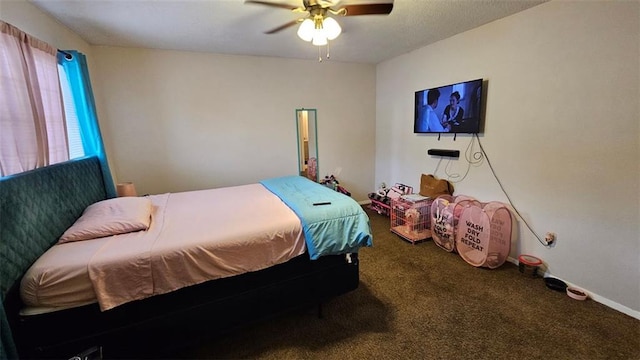 carpeted bedroom with baseboards and a ceiling fan