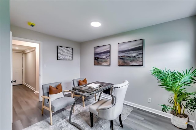home office featuring baseboards and wood finished floors