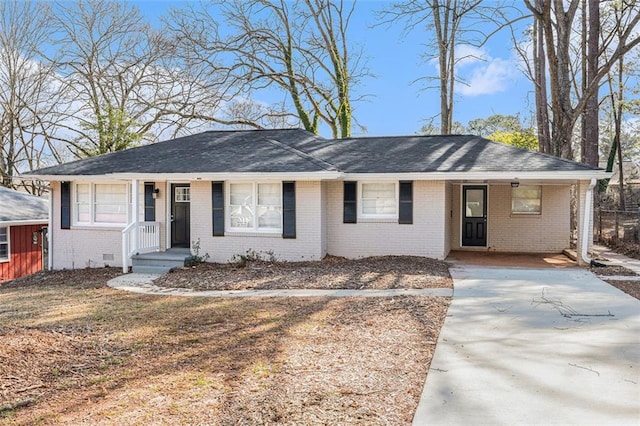 single story home with crawl space, a shingled roof, and brick siding