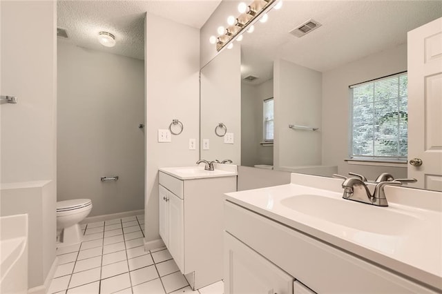 230 Belmont Trl, Covington, GA 30016 - full bathroom with a textured ceiling, two vanities, and tile patterned flooring