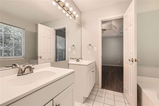 230 Belmont Trl, Covington, GA 30016 - full bathroom with two vanities, tile patterned floors, and a garden tub