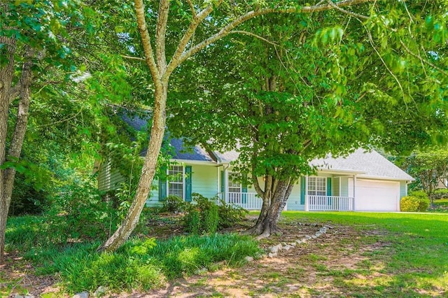 230 Belmont Trl, Covington, GA 30016 - view of front of house featuring covered porch and an attached garage