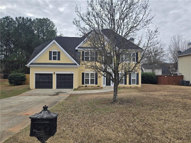 view of front of house featuring a garage and a front yard