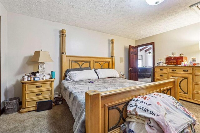 270 Oak Ridge Rd, Covington, GA 30016 - carpeted bedroom featuring a textured ceiling