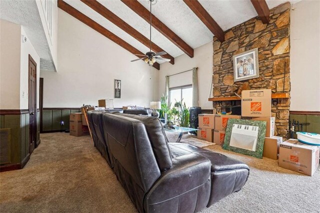 270 Oak Ridge Rd, Covington, GA 30016 - carpeted living area with high vaulted ceiling, a textured ceiling, a wainscoted wall, beam ceiling, and ceiling fan