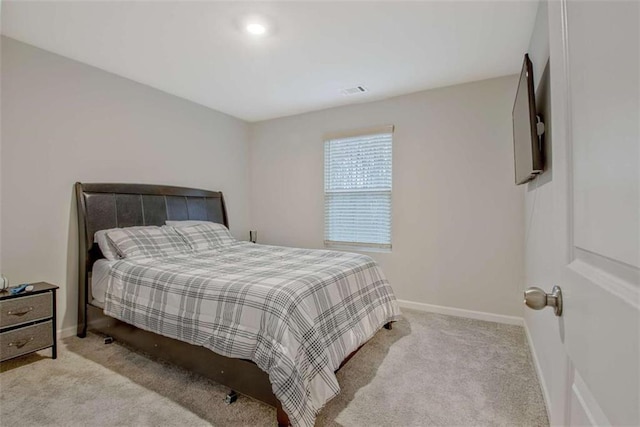 carpeted bedroom with baseboards