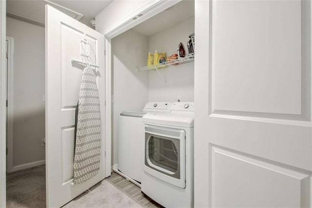 laundry area with laundry area and washer and clothes dryer