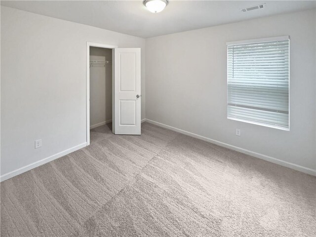 unfurnished room with carpet flooring