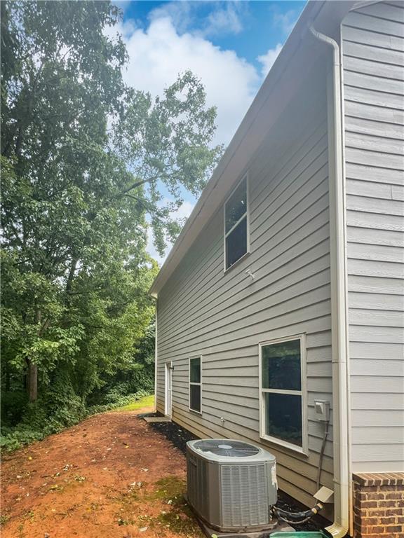 view of property exterior featuring central AC unit