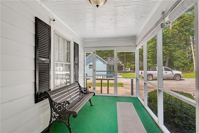 sunroom featuring wood ceiling