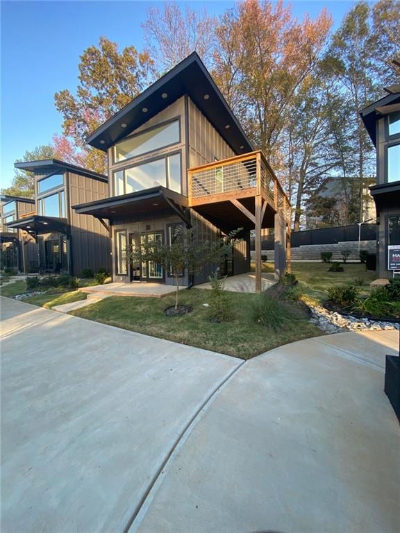 back of house featuring a wooden deck