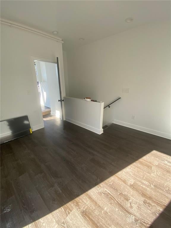 unfurnished room with dark hardwood / wood-style floors