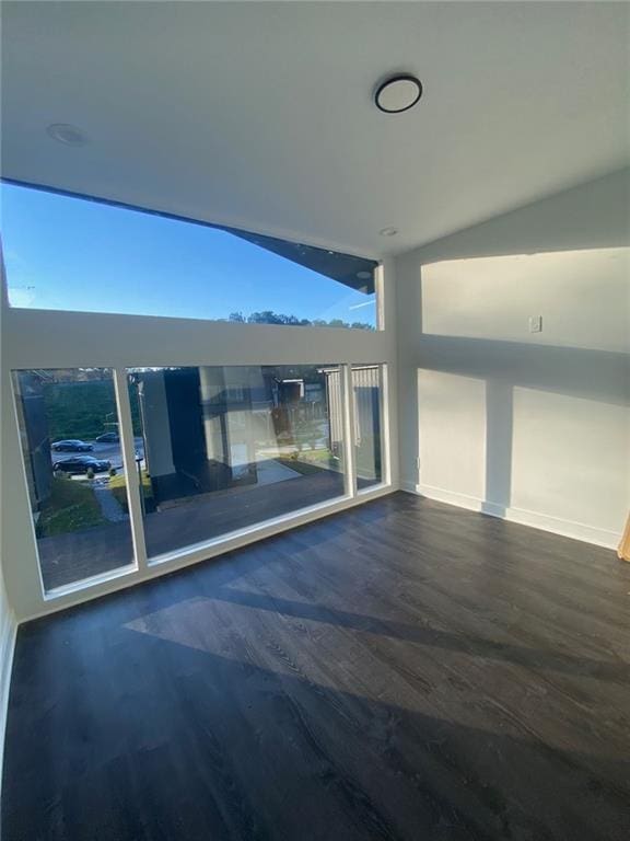 spare room featuring vaulted ceiling