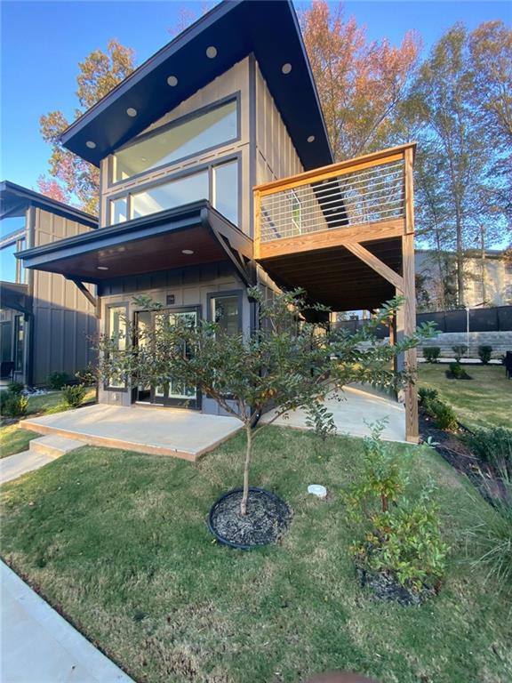 exterior space featuring a lawn and a patio area