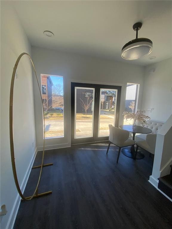 unfurnished dining area with dark hardwood / wood-style flooring