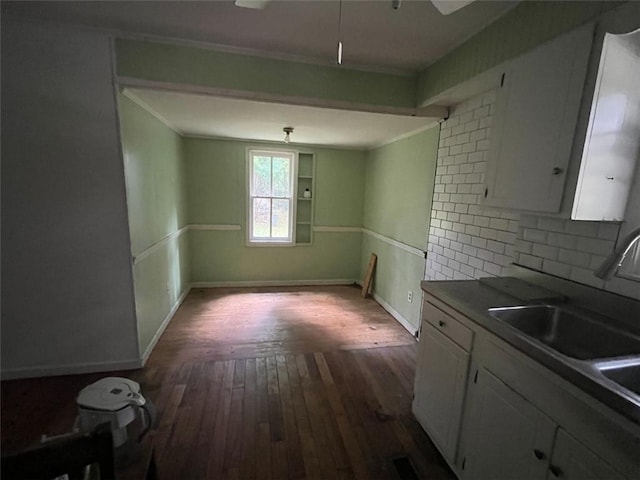 15 Liberty St, Gainesville, GA 30501 - kitchen with dark wood-type flooring, white cabinetry, tasteful backsplash, and dark countertops