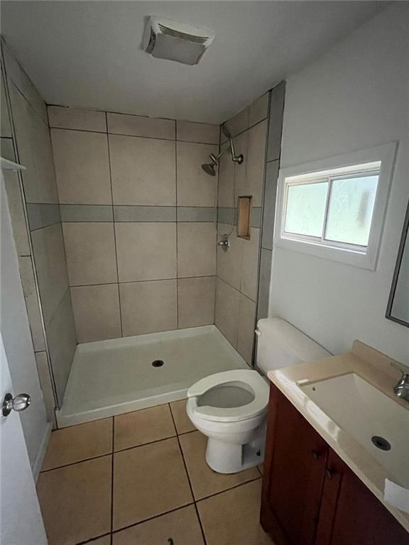15 Liberty St, Gainesville, GA 30501 - full bathroom with vanity, tile patterned floors, and tiled shower