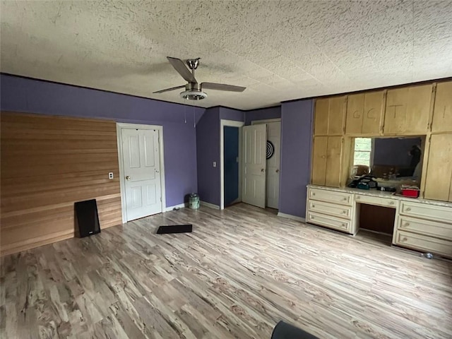 15 Liberty St, Gainesville, GA 30501 - unfurnished living room with a ceiling fan, light wood-style flooring, and built in study area