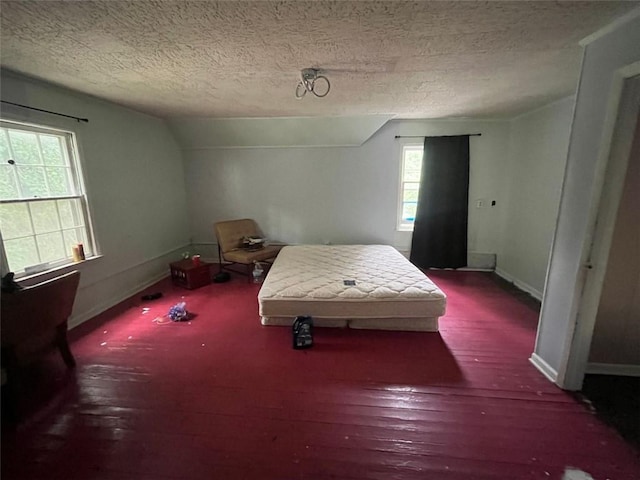 15 Liberty St, Gainesville, GA 30501 - bedroom with a textured ceiling, vaulted ceiling, and wood finished floors
